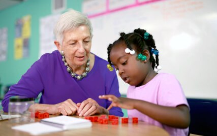 Marilyn Burns working with a student